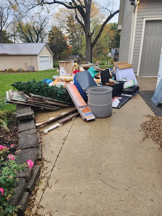 Dumpster being loaded with debris for 3 Yard Dumpster Rental in Steele Creek